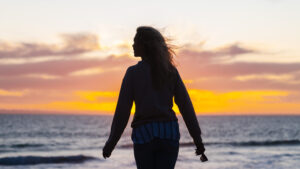 Woman reflecting during a slow and gentle life reset, embracing inner growth, balance, and a softer way of living.